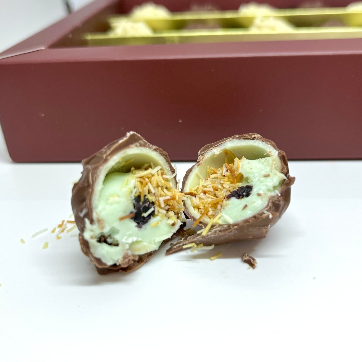 Ema Chocolate Milk and White Chocolate Truffles with Blueberry Cream Filled - Merry Christmas Box - 250g - TryAladdin