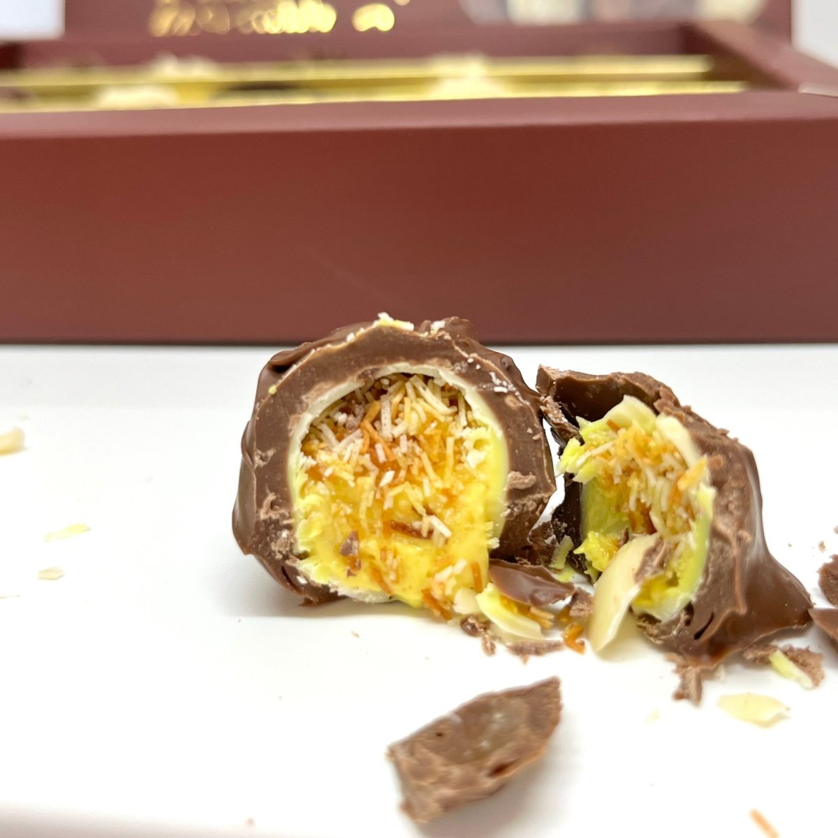 Ema Chocolate Milk and White Chocolate Truffles with Orange Cream Filled - Merry Christmas Box - 250g - TryAladdin